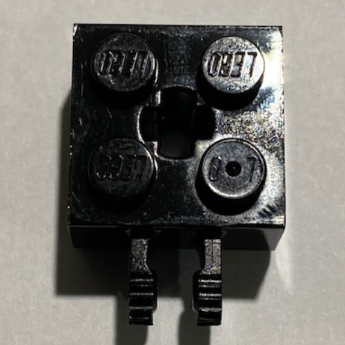Hinge Brick 2 x 2 Locking with 2 Fingers Vertical and '+' Axle Hole, 9 Teeth (Black)