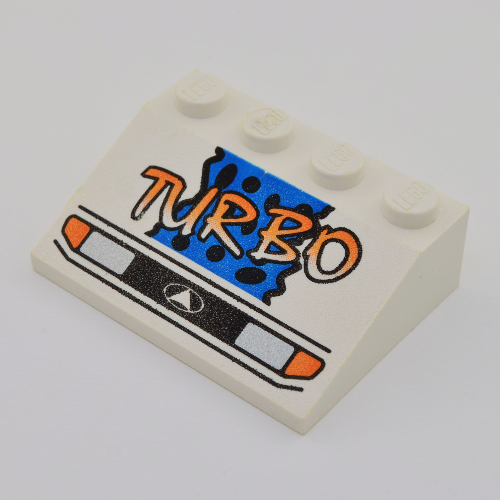 Brick Sloped 33° 3 x 4 with Headlights, Yellow 'TURBO', Blue Background and Black Spots Print (White)
