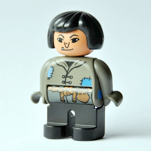 Duplo Figure, Early, Hair Bob Black, Black Legs, Tunic with Blue Patches and Rope Belt, Wart on Nose (Actress) (Dark Gray)